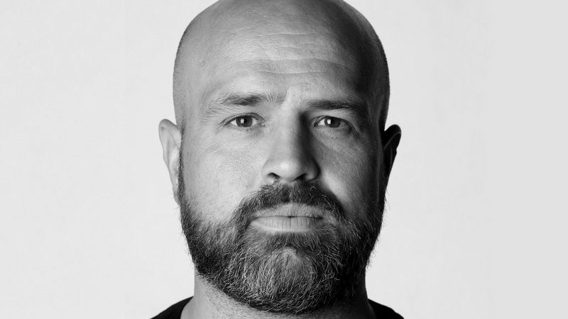  A black and white headshot of Canon Ambassador Richard Heathcote.