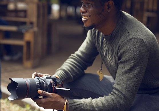 Photographer and Canon Ambassador Emmanuel Oyeleke with his Canon camera.