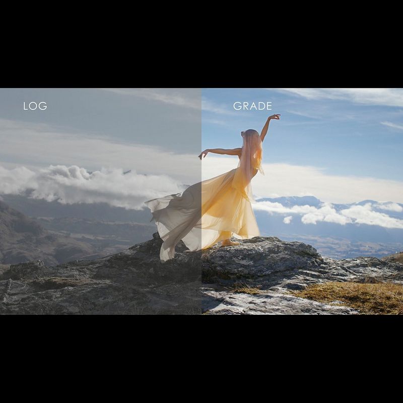 A ballet dancer in a flowing yellow dress and shawl poses atop a mountain overlooking a valley, with half the frame showing the Canon Log version, and the other the graded one.