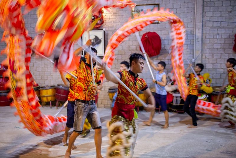 In a photograph by Travis Hodges, dragon dancers perform at a Mid-Autumn Festival.