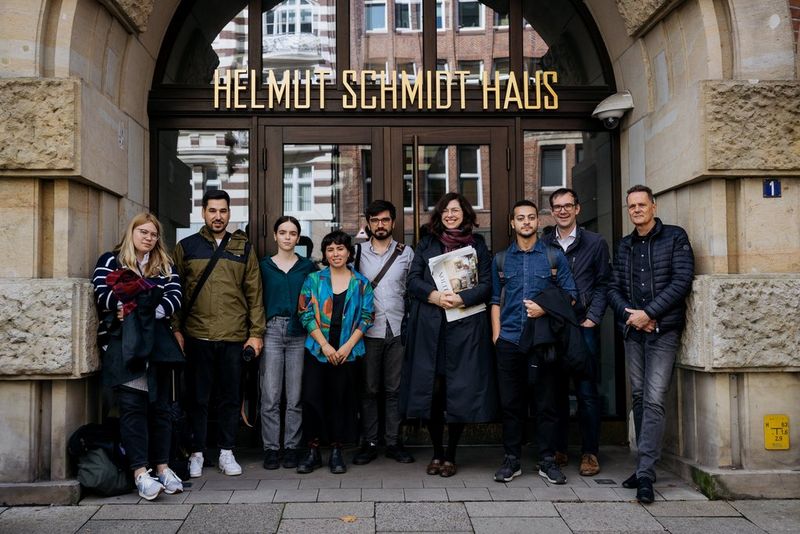 The finalists of the Canon Student Development Programme standing with staff from Die Zeit and Canon Europe outside Helmut Schmidt Haus in Hamburg, Germany.