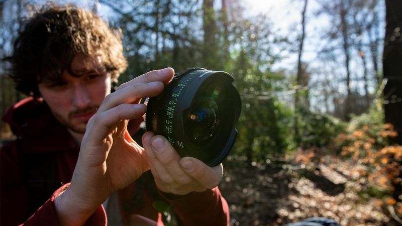 A filmmaker with a Canon Sumire Prime lens. 