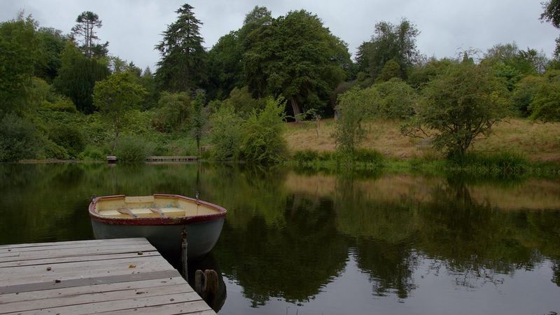 The same scene of a boat tied to a jetty, shot using Canon Log, after grading, with the colours and tones much richer.