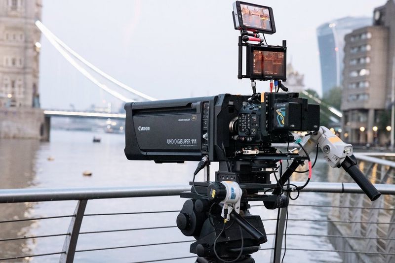 A Canon UJ111x8.3B broadcast lens mounted on a Canon EOS C300 Mark III, with the river Thames and Tower Bridge in the background.