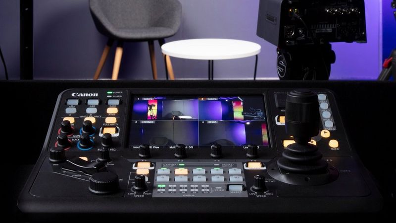 A close up of the Canon RC-IP1000 PTZ controller dials and screen in a studio setting.