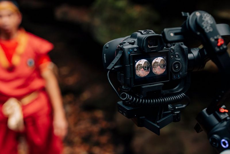 A view from the rear of an EOS R5, with the LCD screen showing two fisheye images side-by-side.