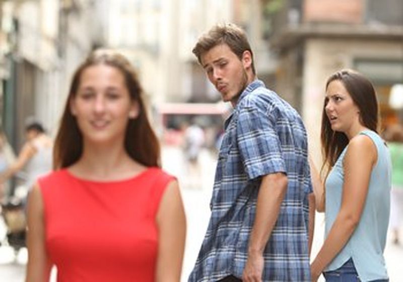 The original famous ‘distracted boyfriend’ image of a young man looking admiringly over his shoulder at a young woman as he walks with his girlfriend. © Antonio Guillem