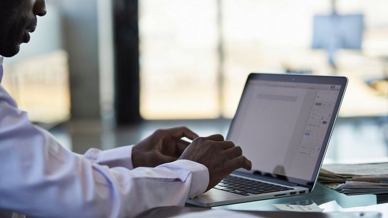 a man working on his laptop