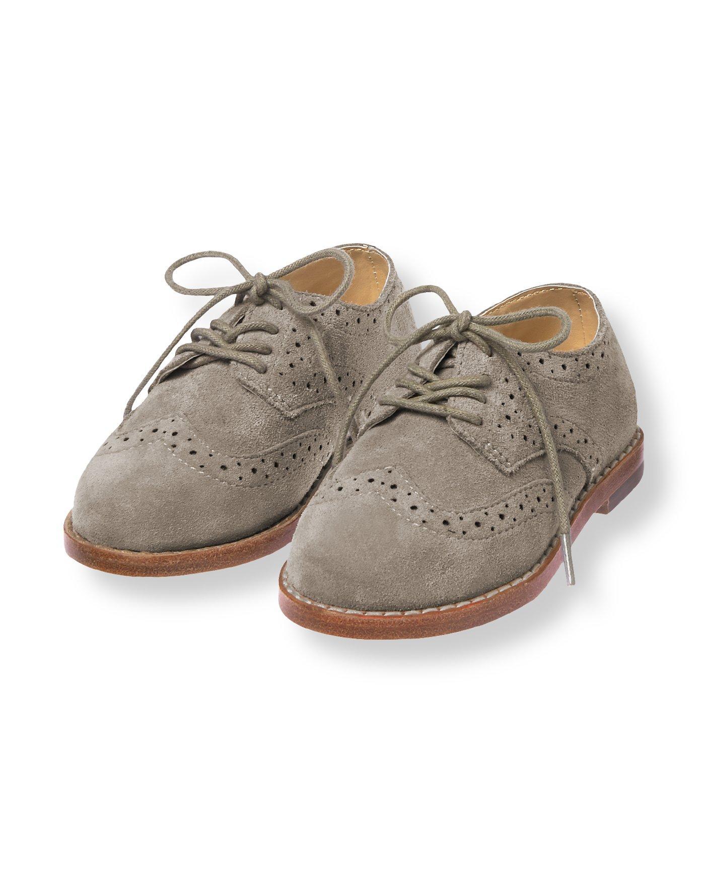 grey and white wingtip shoes
