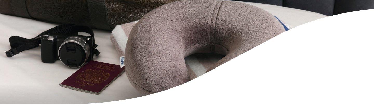 A Tempur Neck pillow in amongst other travel items