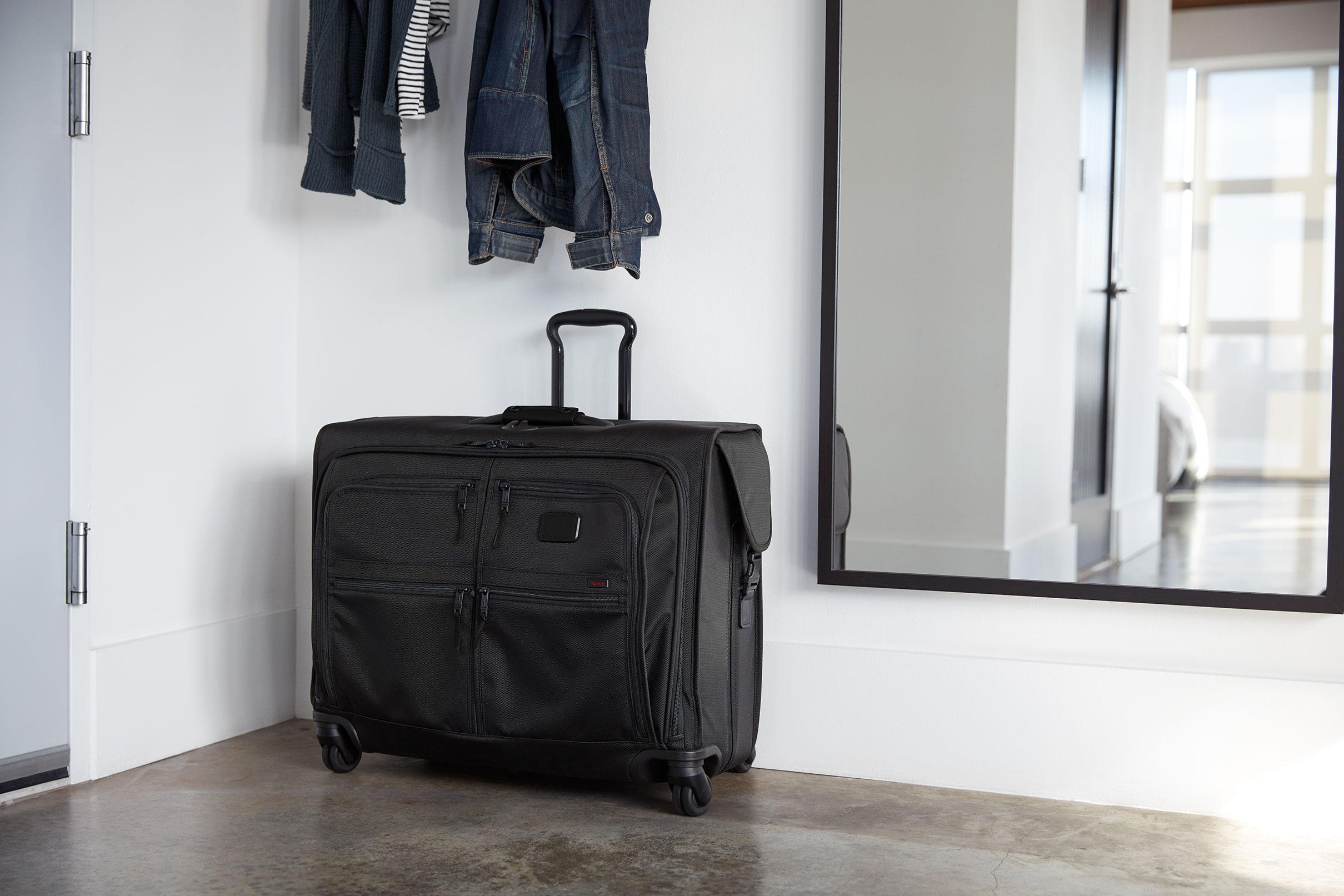 girls rolling luggage