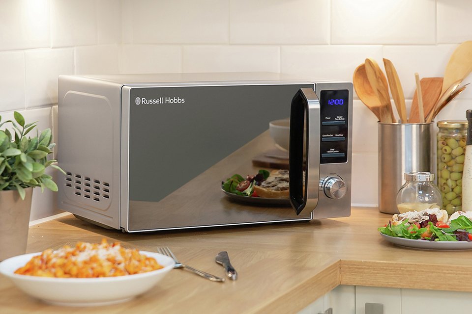 A Russel Hobbs Buckingham standard microwave on a kitchen counter.