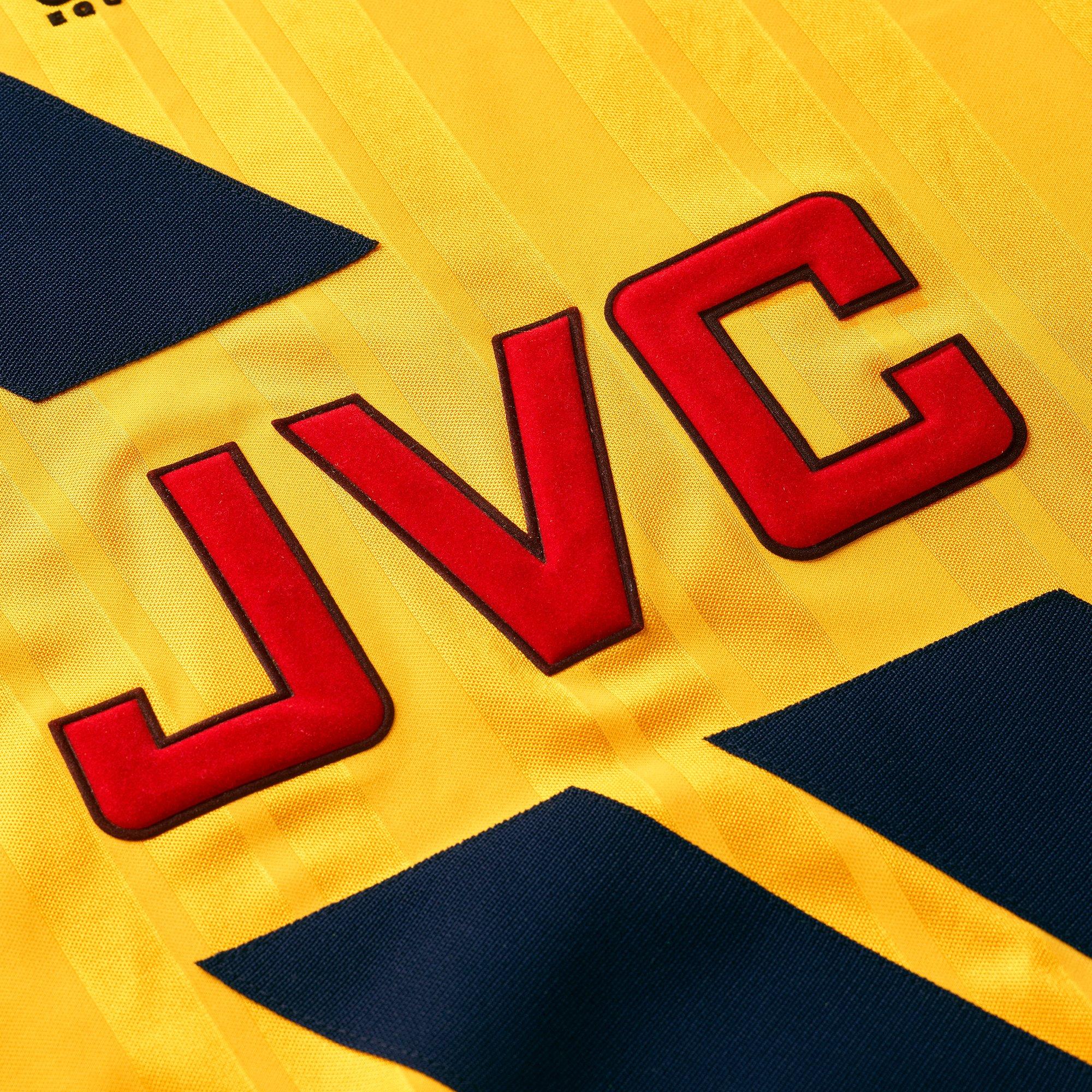 Yellow jvc arsenal store shirt