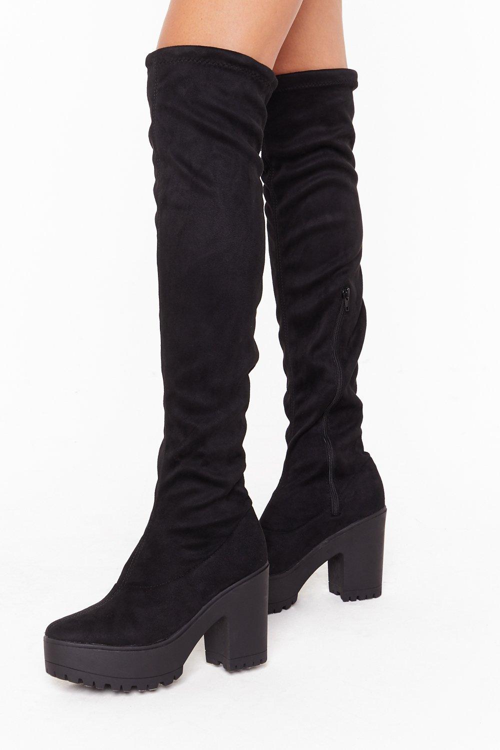 black cleated sole over the knee boots