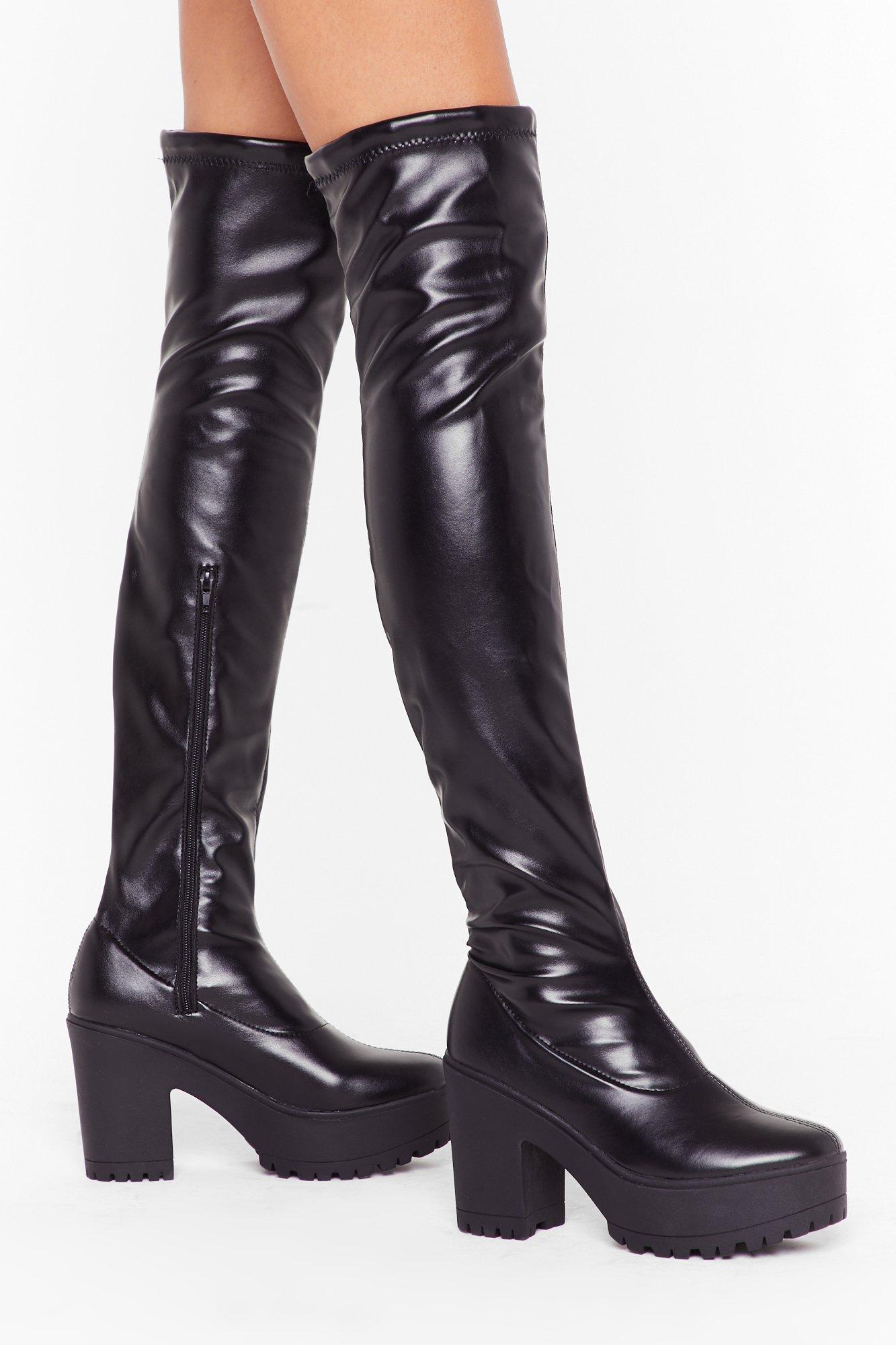 black cleated sole over the knee boots