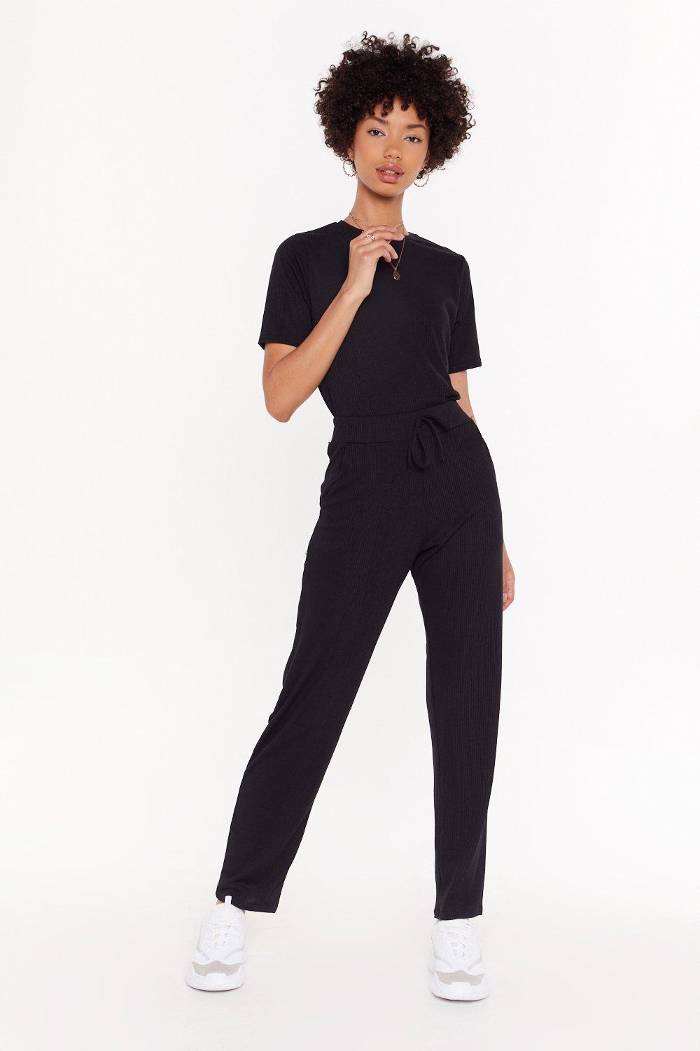 black joggers and black shirt