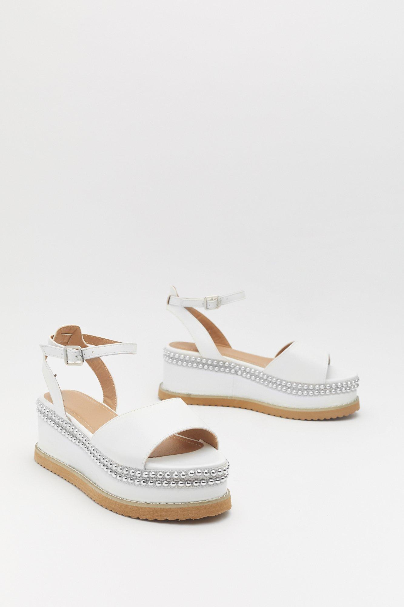 white studded flatforms