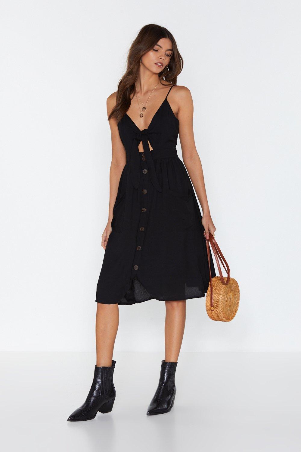 black dress with buttons down the front