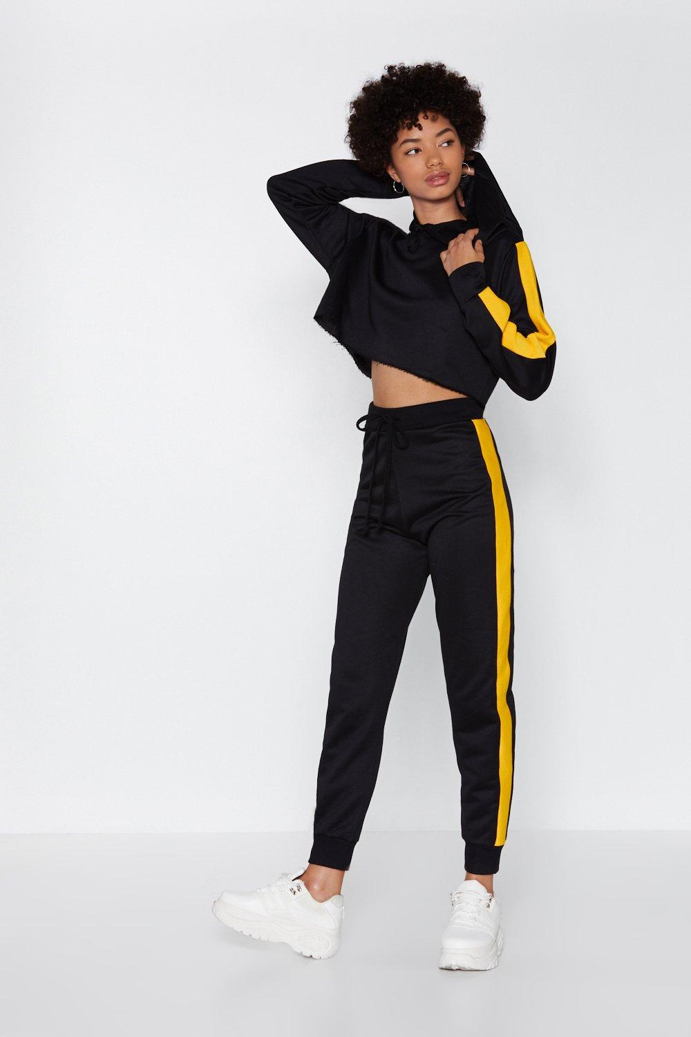 black joggers with yellow stripe