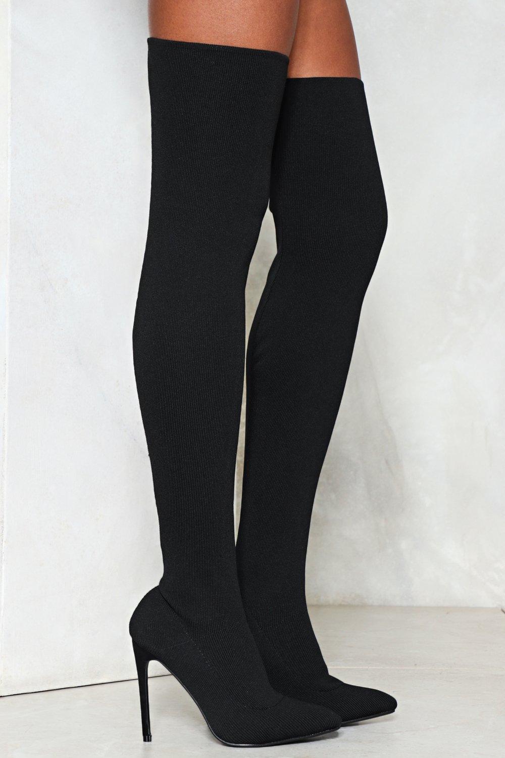 black fitted thigh high boots