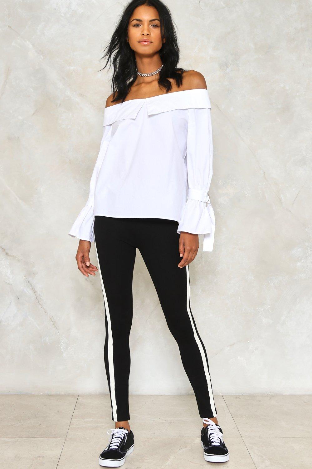 white shirt with black leggings