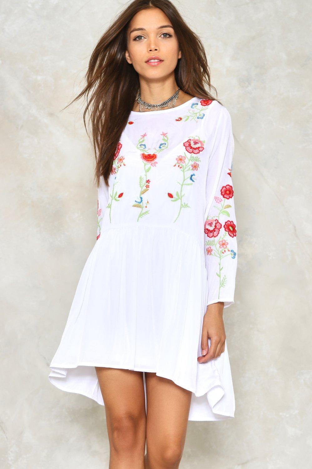 white dress with embroidered flowers