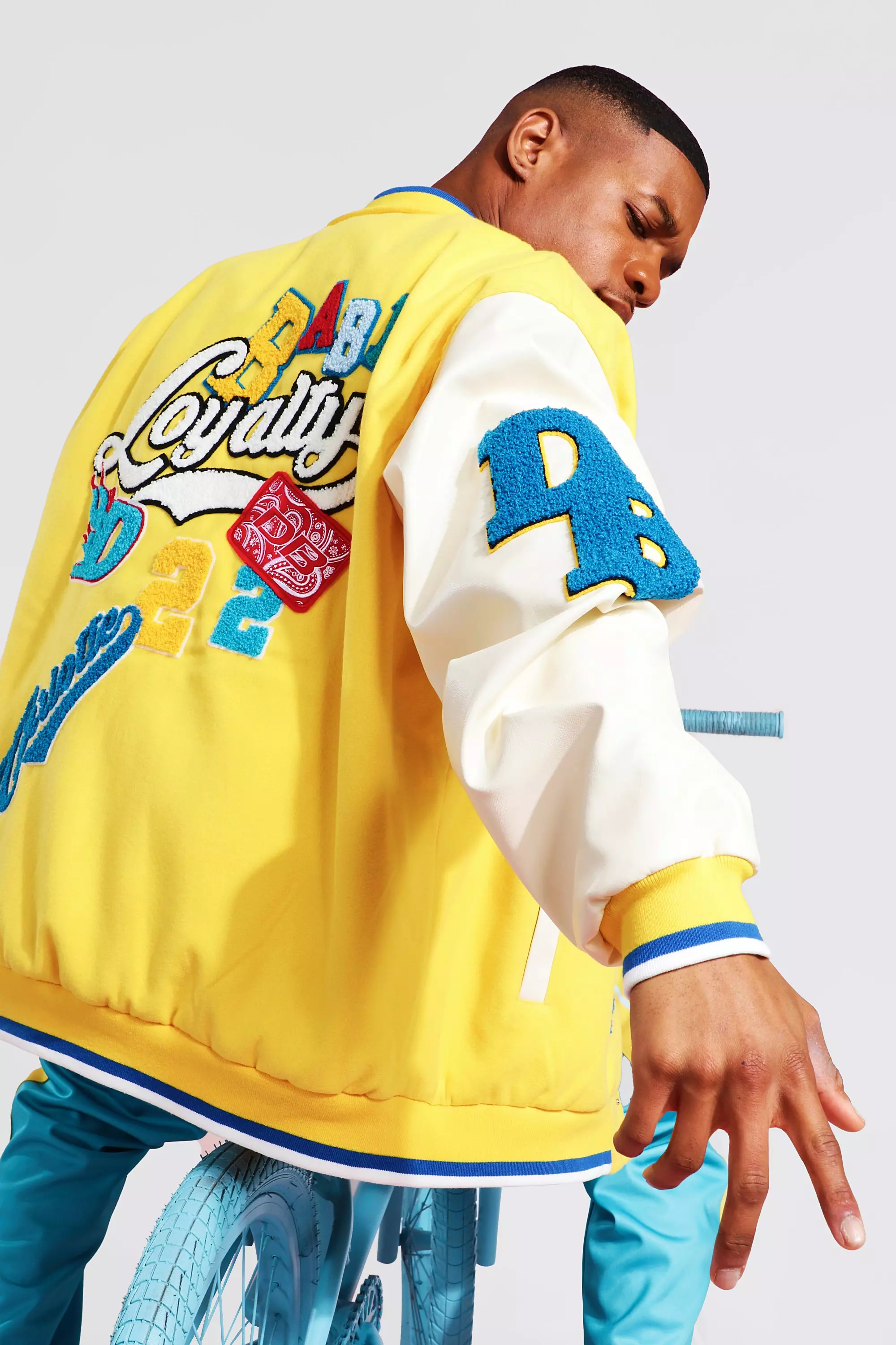 Oversized Loyalty Varsity Bomber | boohooMAN USA