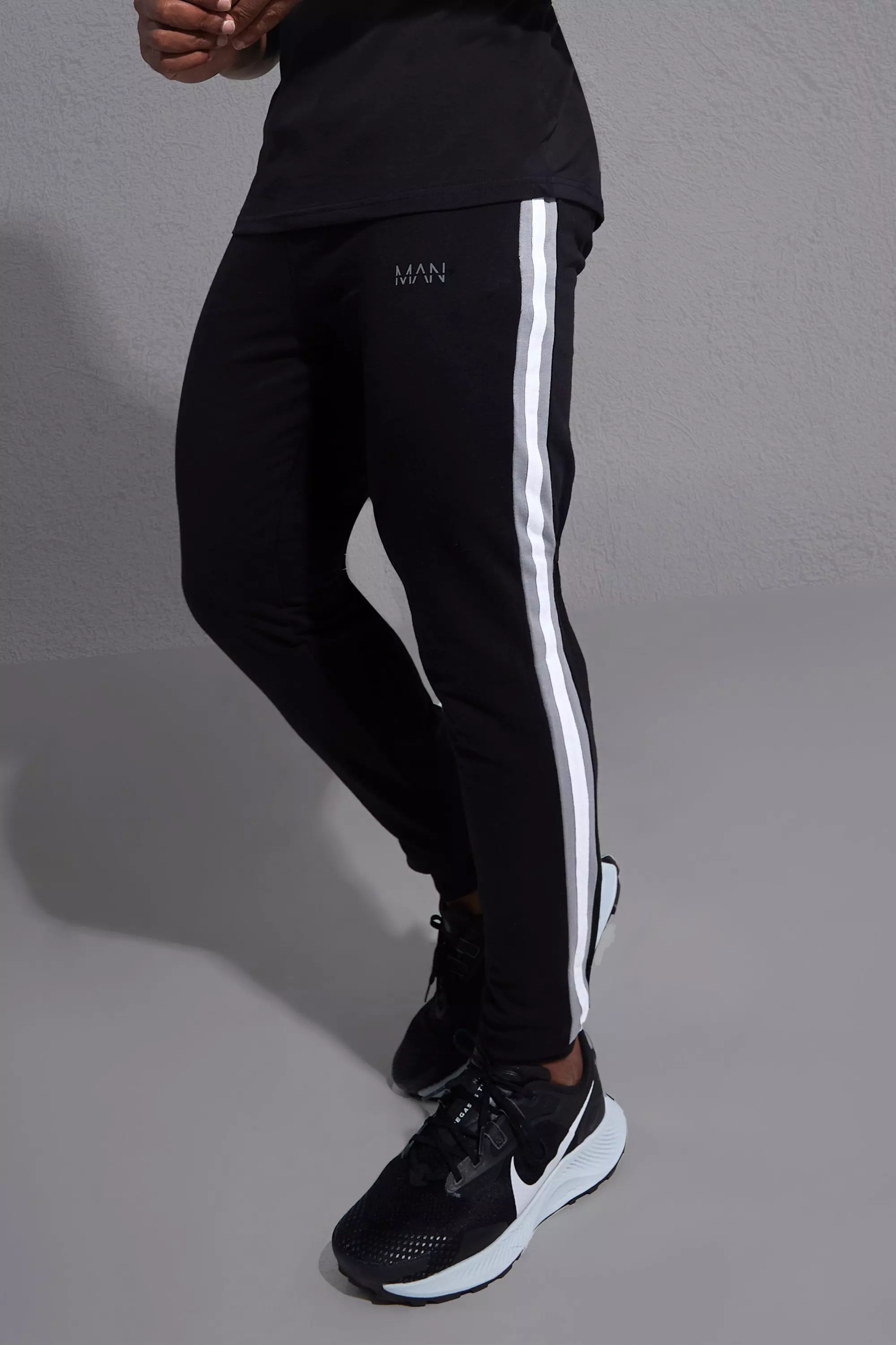 Joggers with side stripe hot sale mens