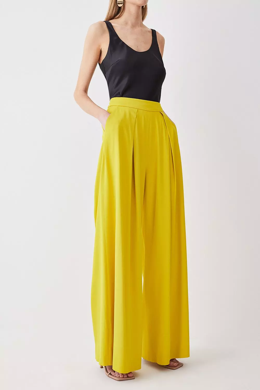 Asymmetric pleated wide leg pants in orange