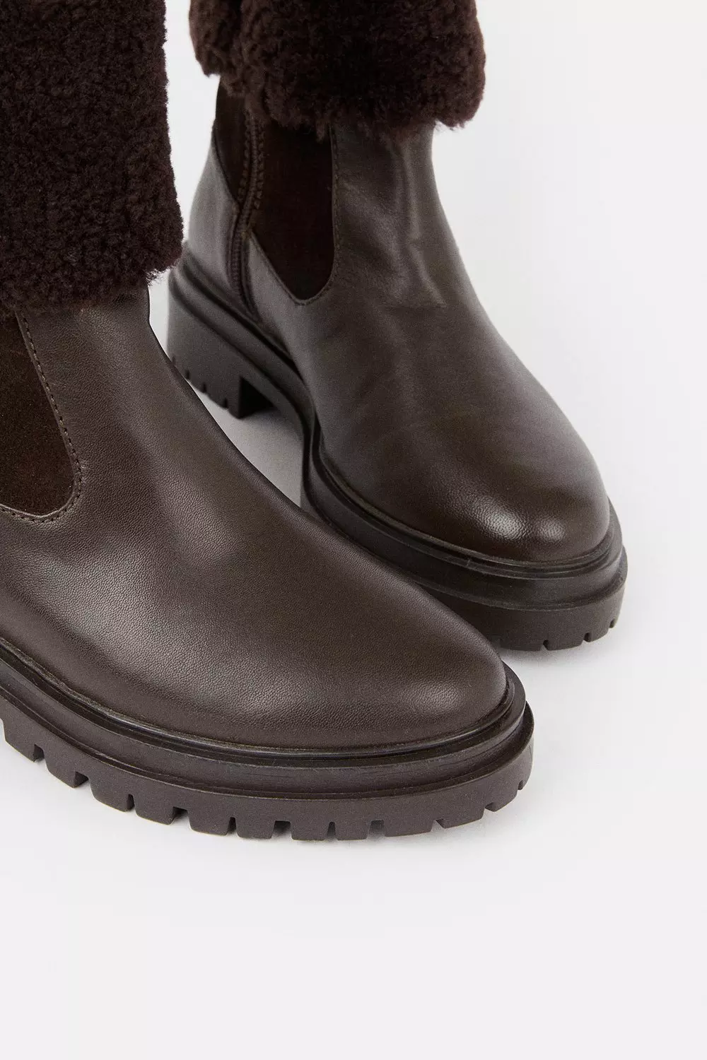 black boots with brown trim