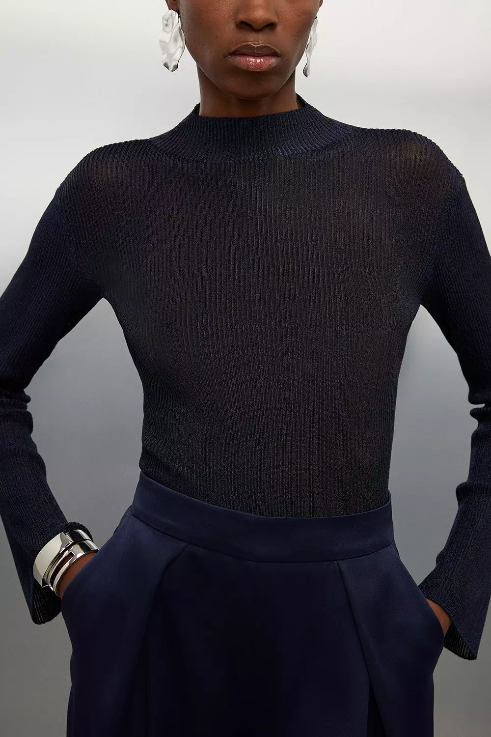 Metallic shop turtleneck top