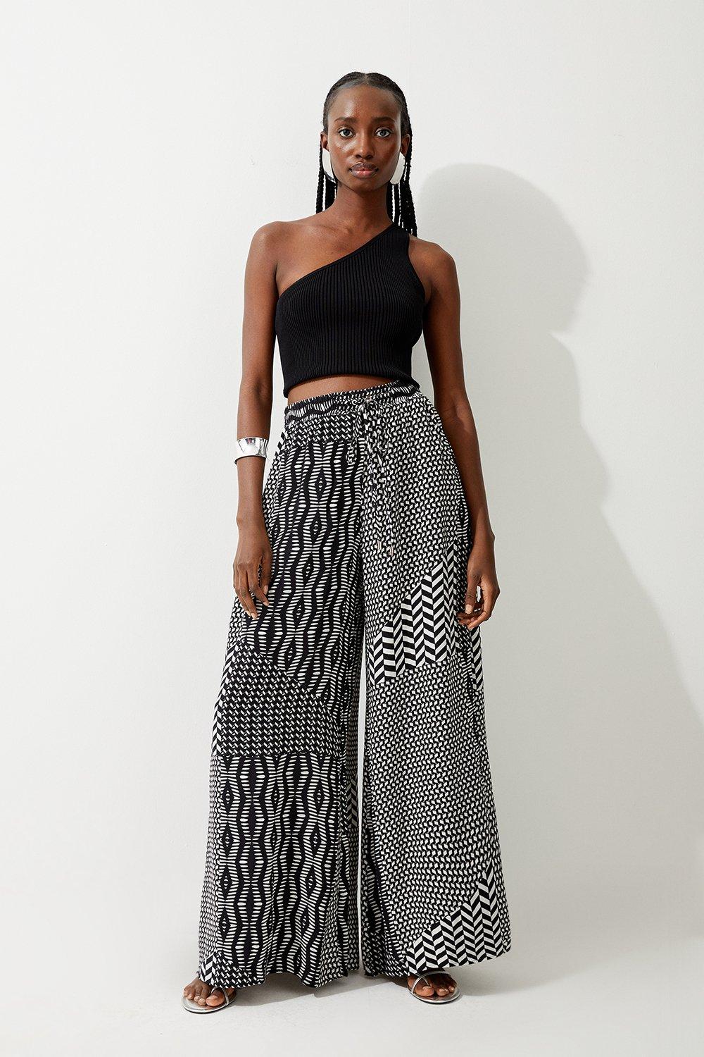 blue wrap around crop top, striped palazzo pants, wide leg pants