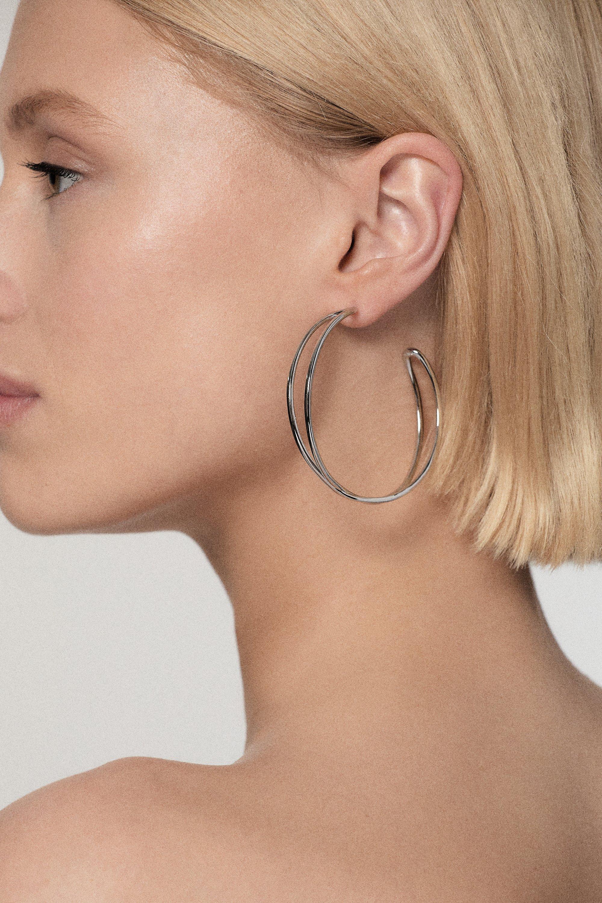 Silver Tone Criss Cross Hoop Earring - Silver