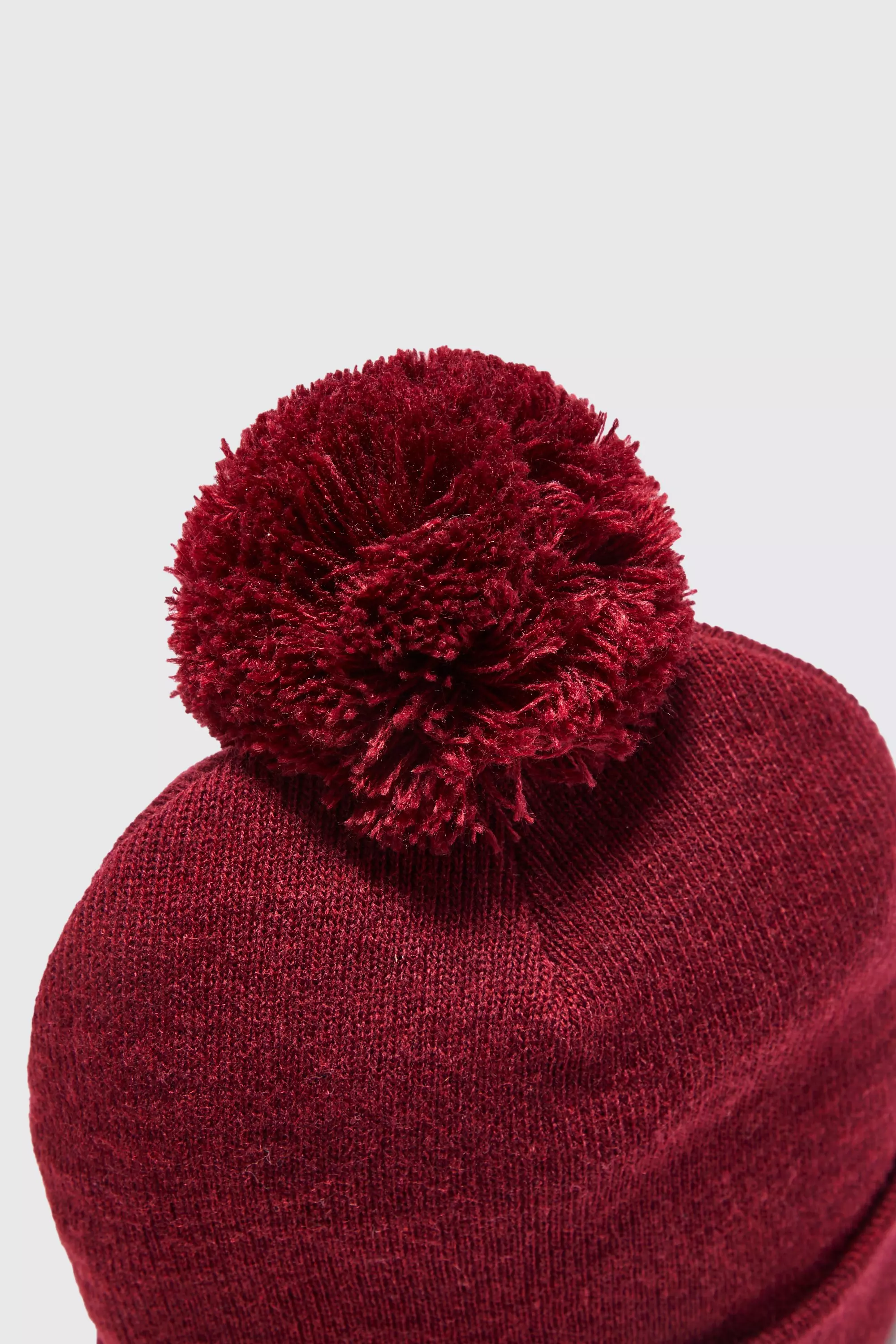 Bonnet uni à pompon