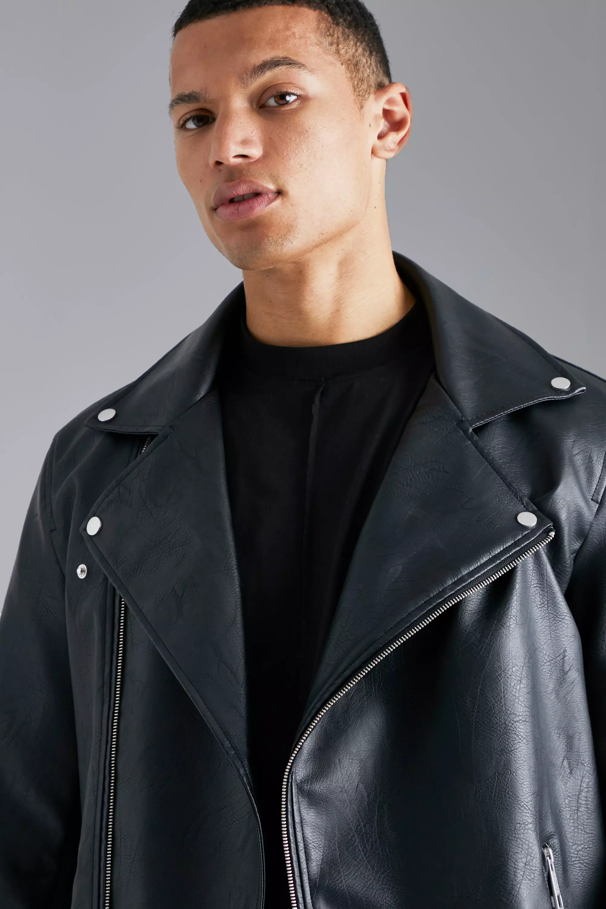 Bershka faux leather biker jacket in black