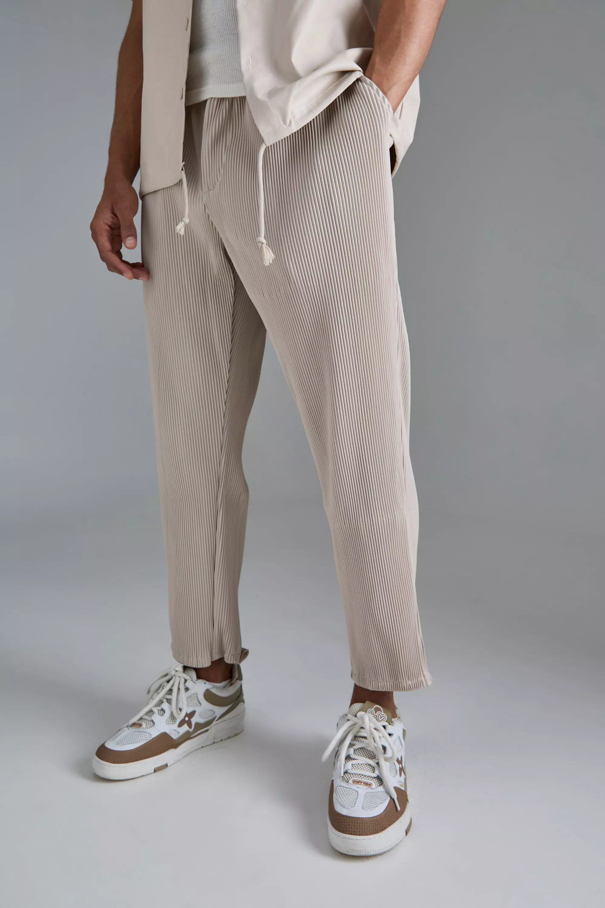 Grey Tapered technical-pleated trousers