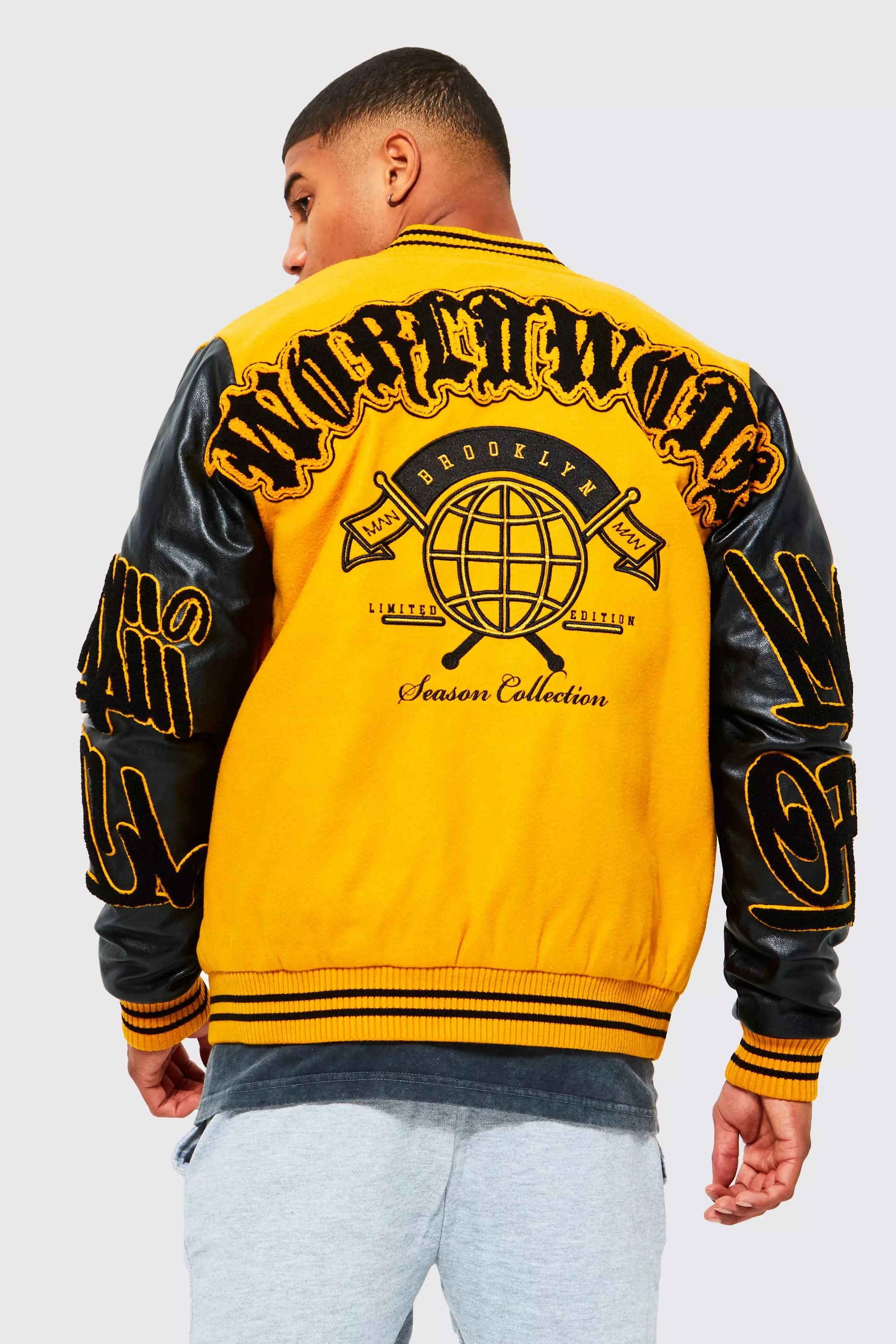 Mennace varsity bomber jacket in yellow with gothic logo