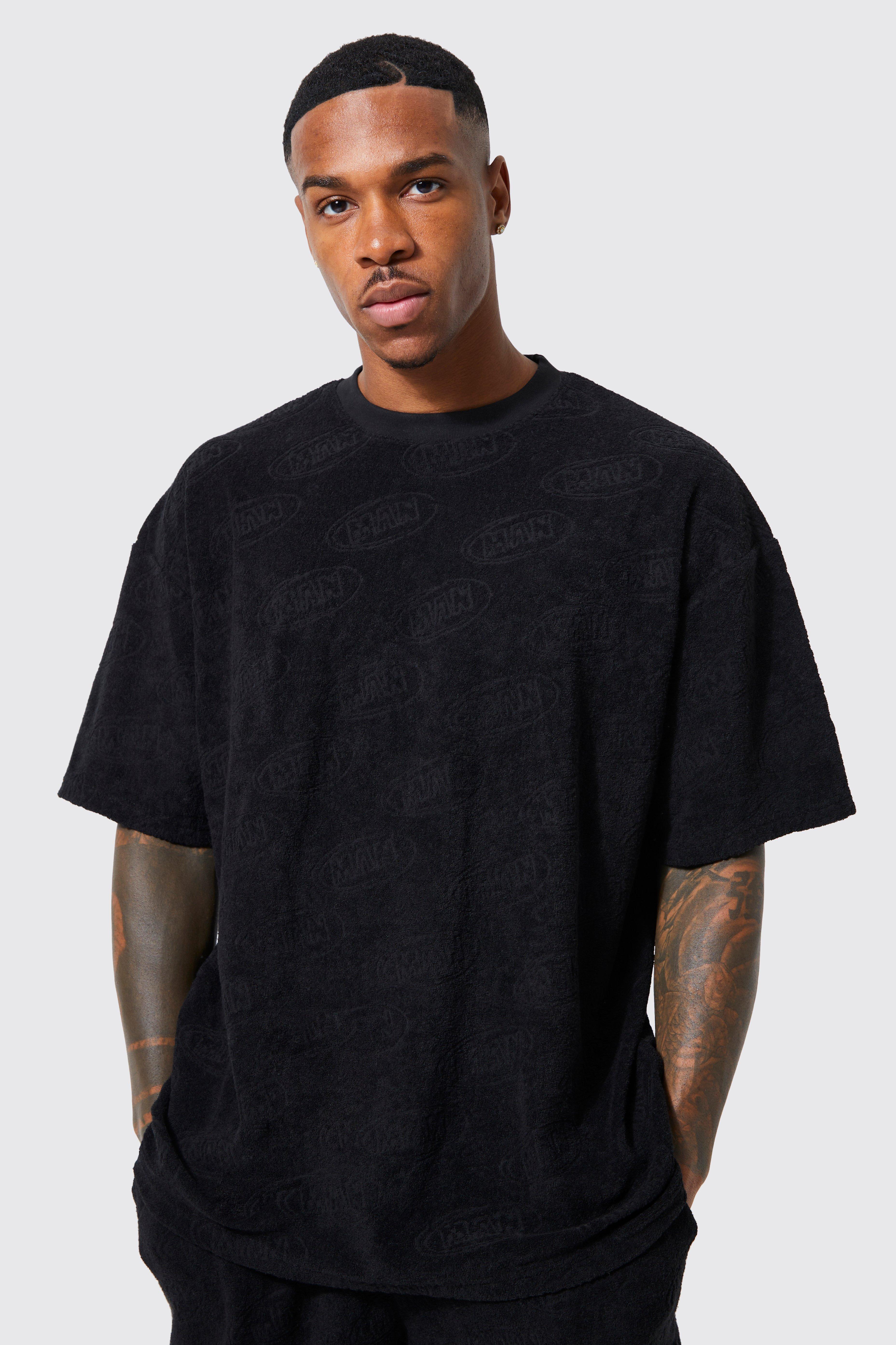 mens black oversized debossed man t-shirt, black