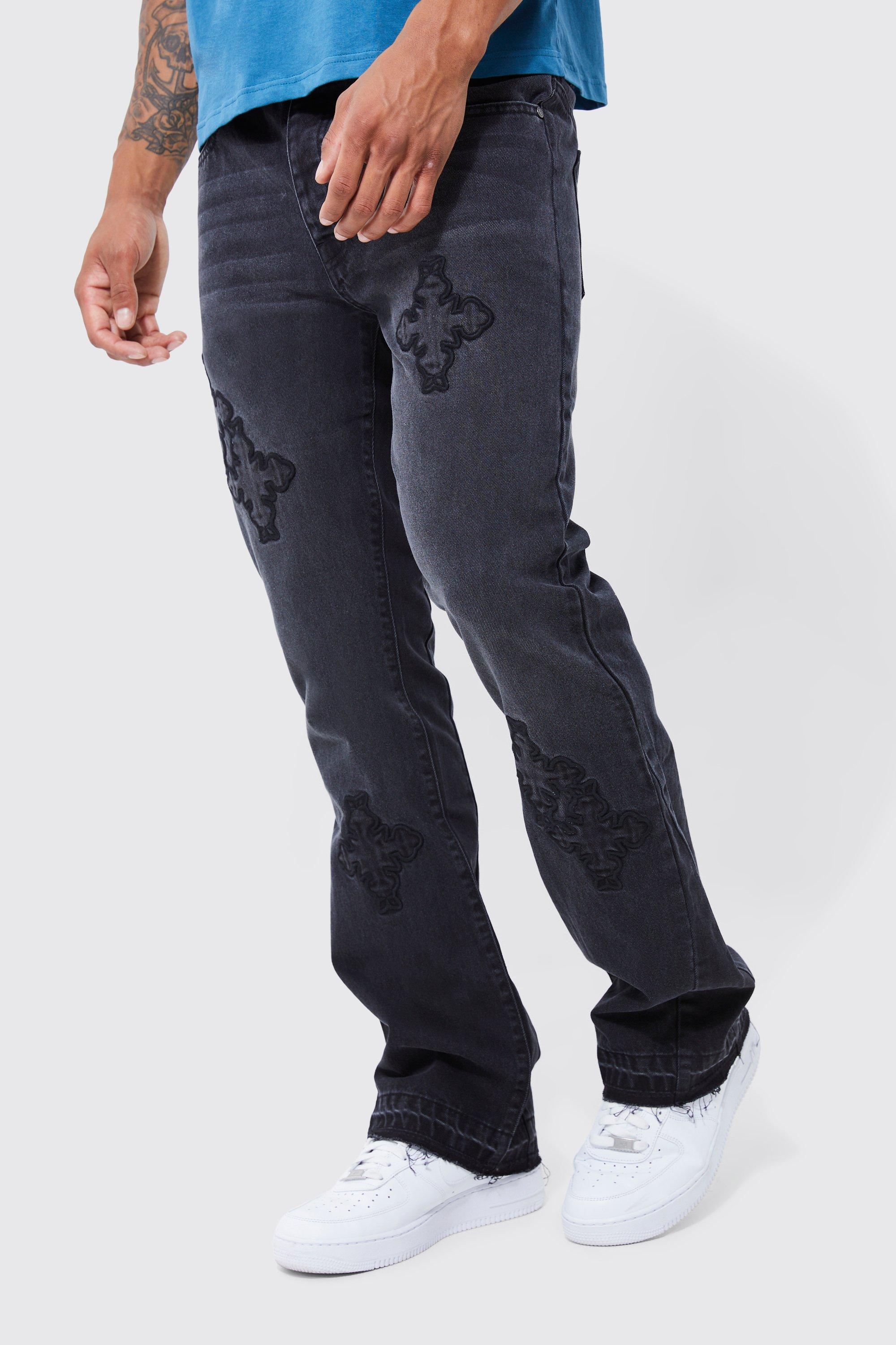 Image of Jeans a zampa Slim Fit in denim rigido con applique a croce, Nero