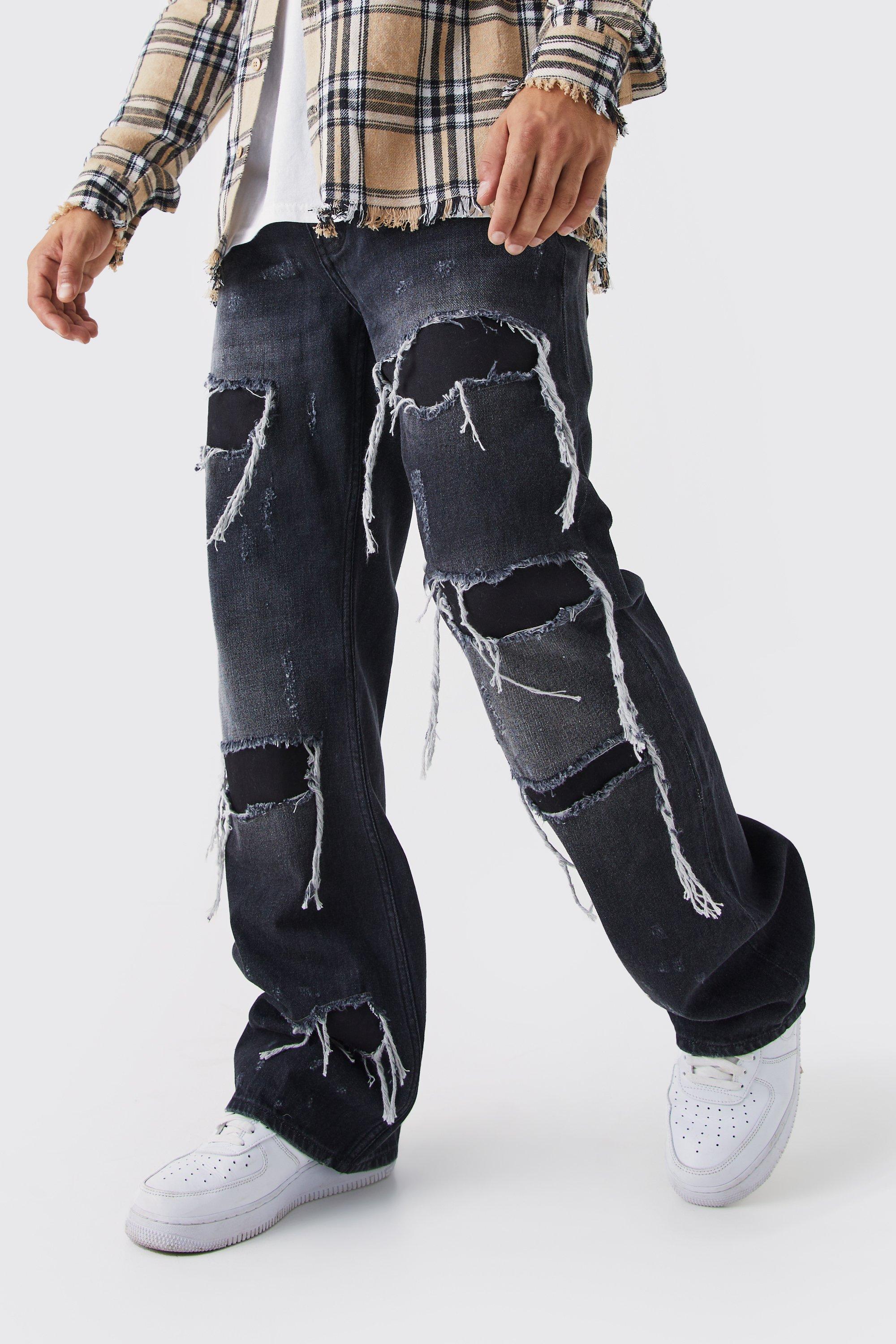 Image of Jeans rilassati in denim rigido a zampa con inserti e strappi, Nero