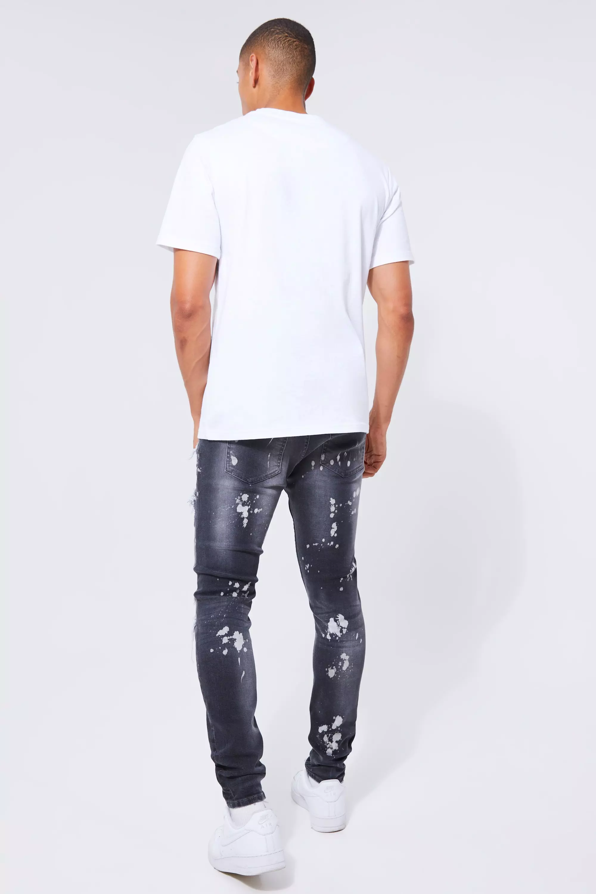 Mens skinny paint splatter hot sale jeans