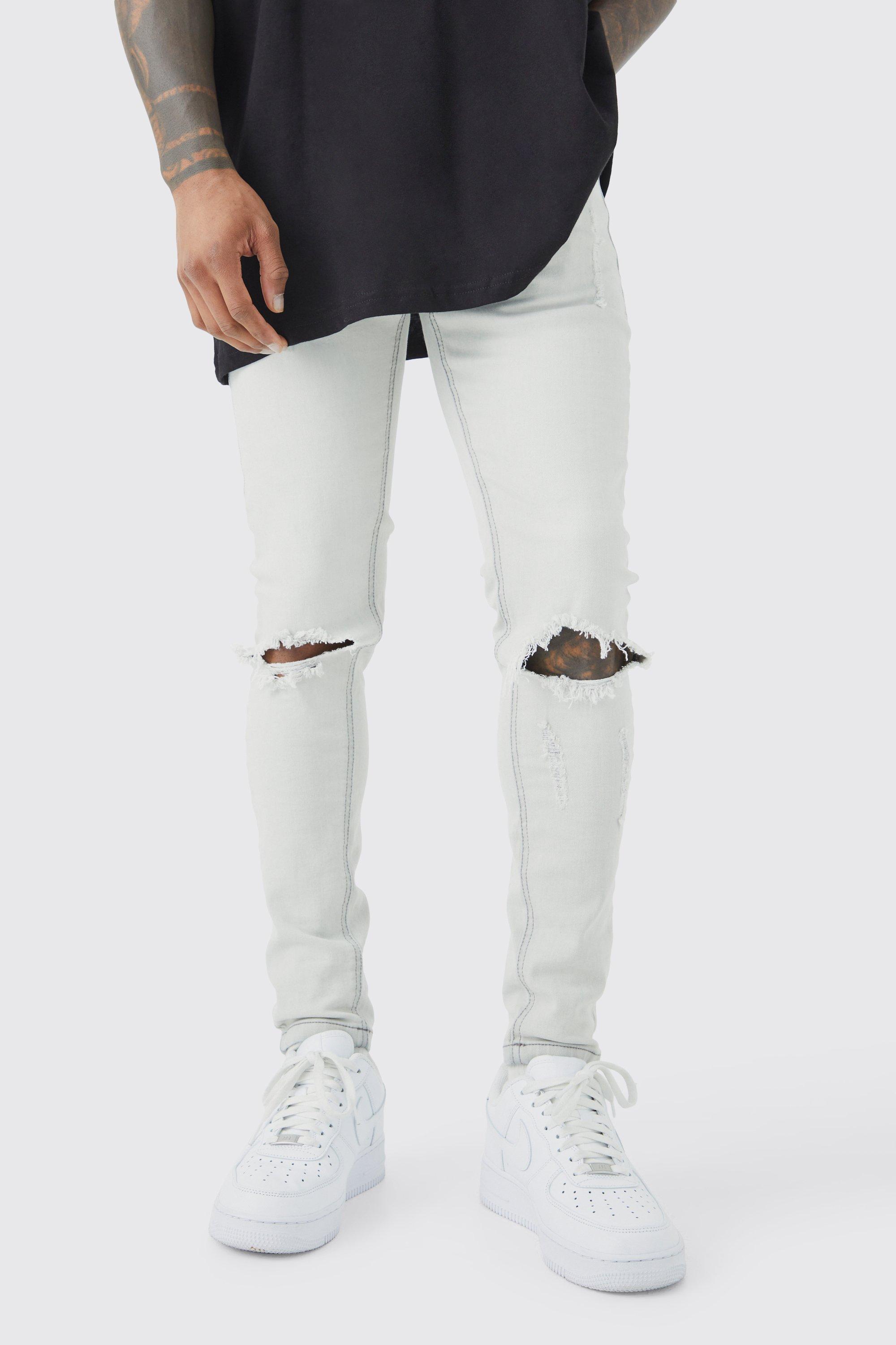 Image of Jeans Super Skinny Fit in Stretch con strappi e pieghe sul fondo, Grigio