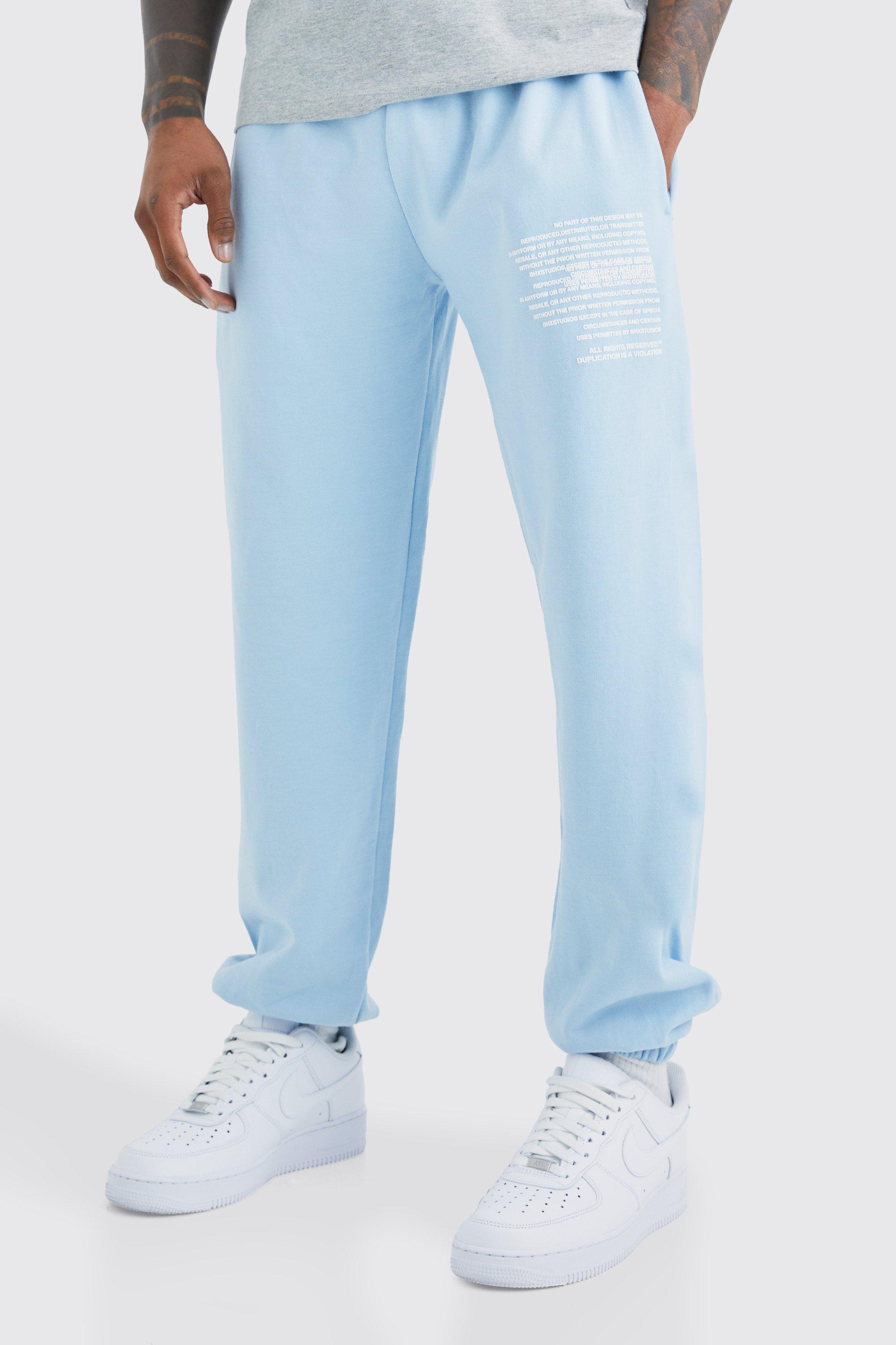 Image of Pantaloni tuta con grafica di testo, Azzurro