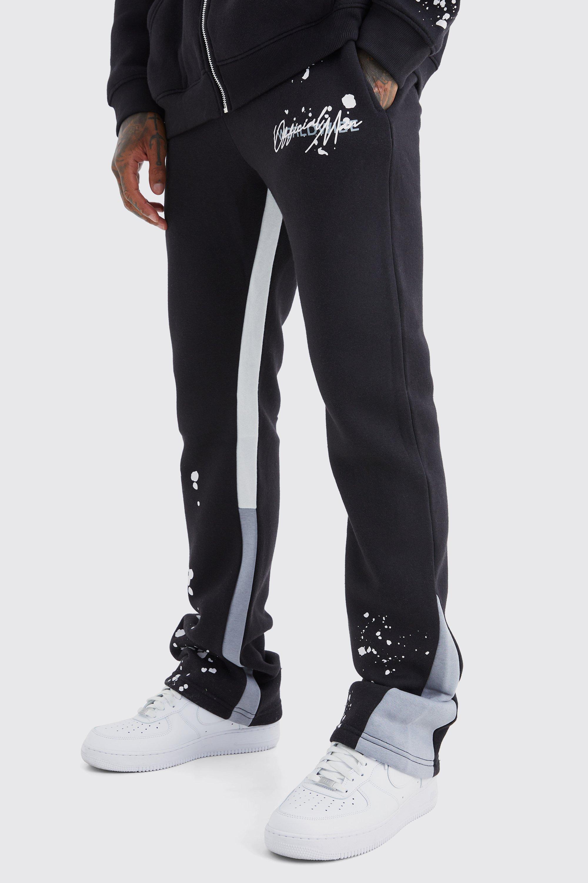 Image of Pantaloni tuta Slim Fit a zampa con pieghe sul fondo e inserti, Nero