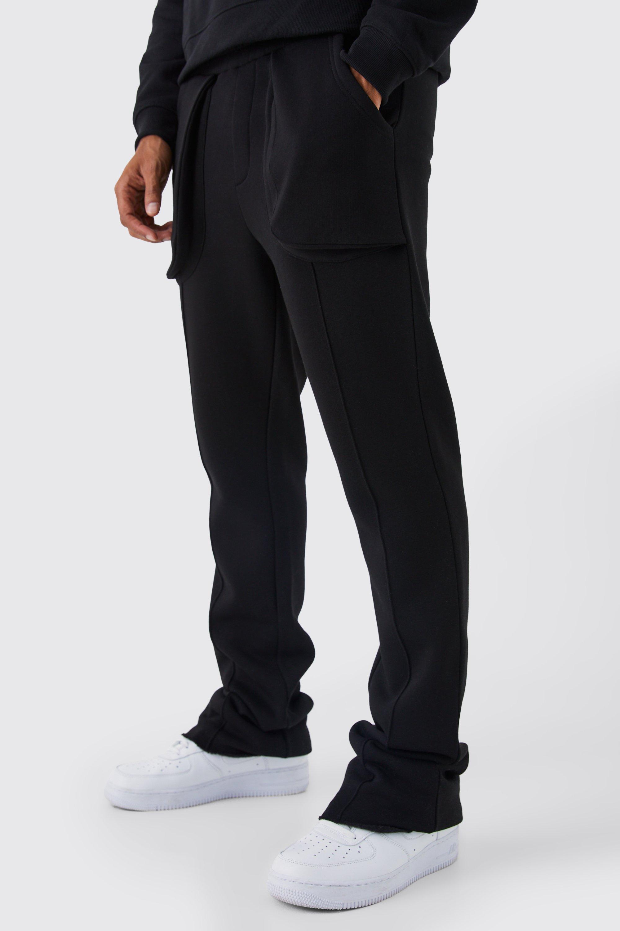 Image of Pantaloni tuta a zampa Slim Fit con tasche in rilievo e dettagli in rilievo, Nero