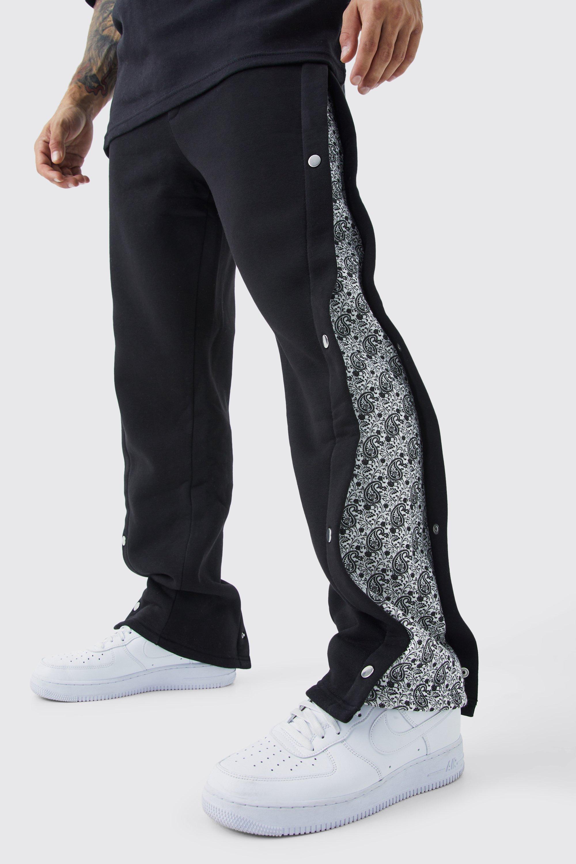Image of Pantaloni tuta rilassati con stampa, pannelli laterali e bottoni a pressione, Nero