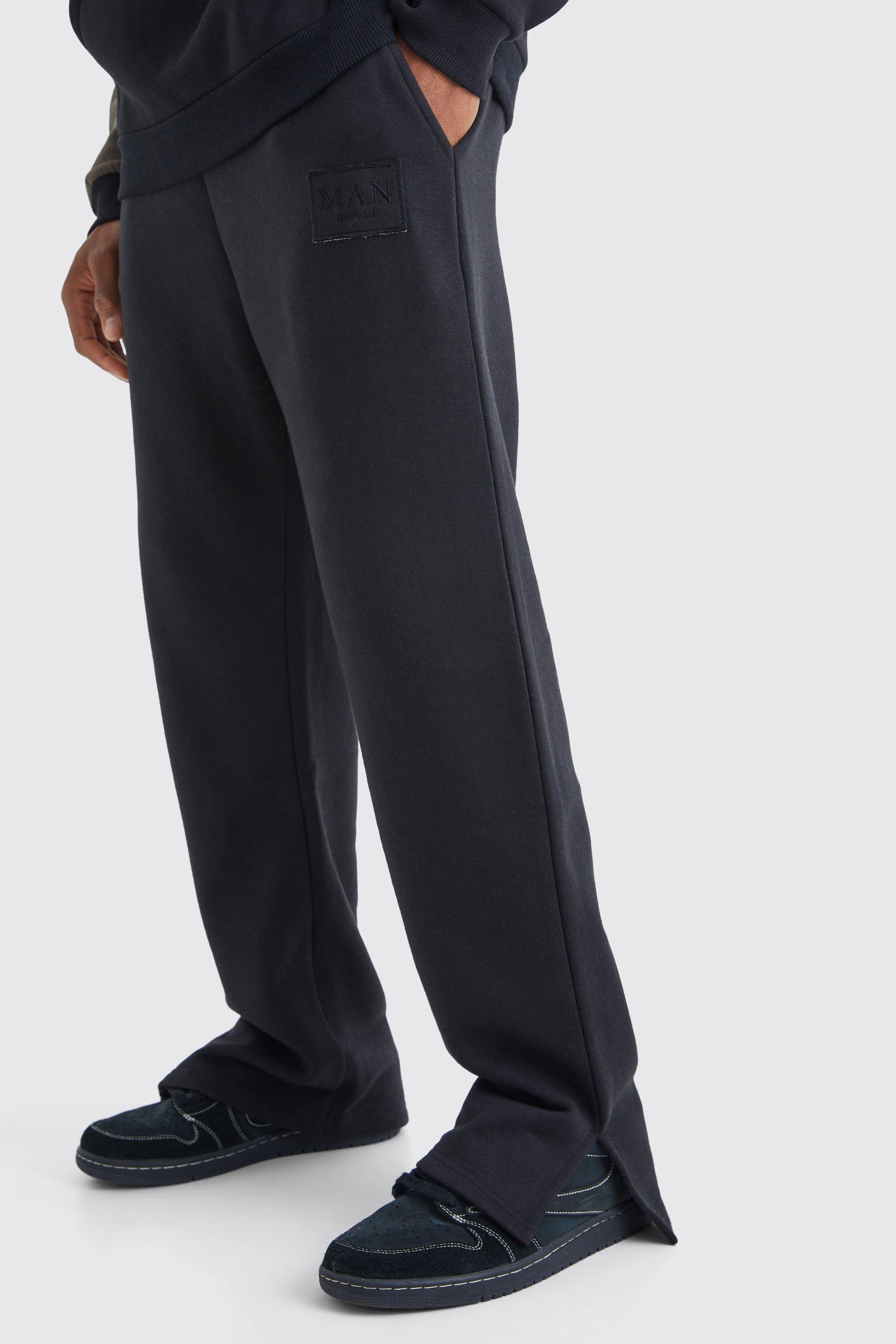 Image of Pantaloni tuta con spacco sul fondo e stemma a effetto consumato, Nero