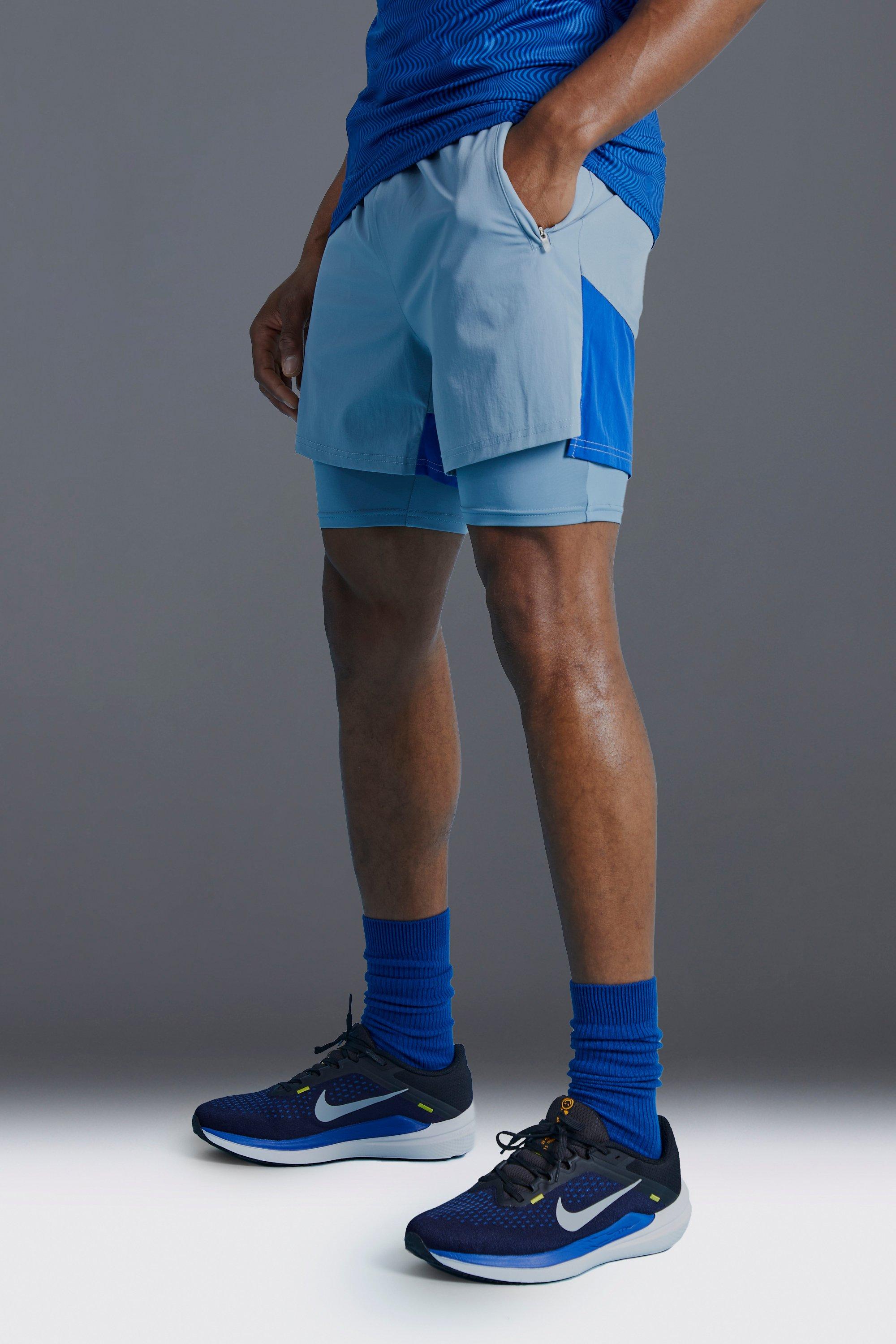 Image of Pantaloncini attillati Man Active a blocchi di colore, Azzurro