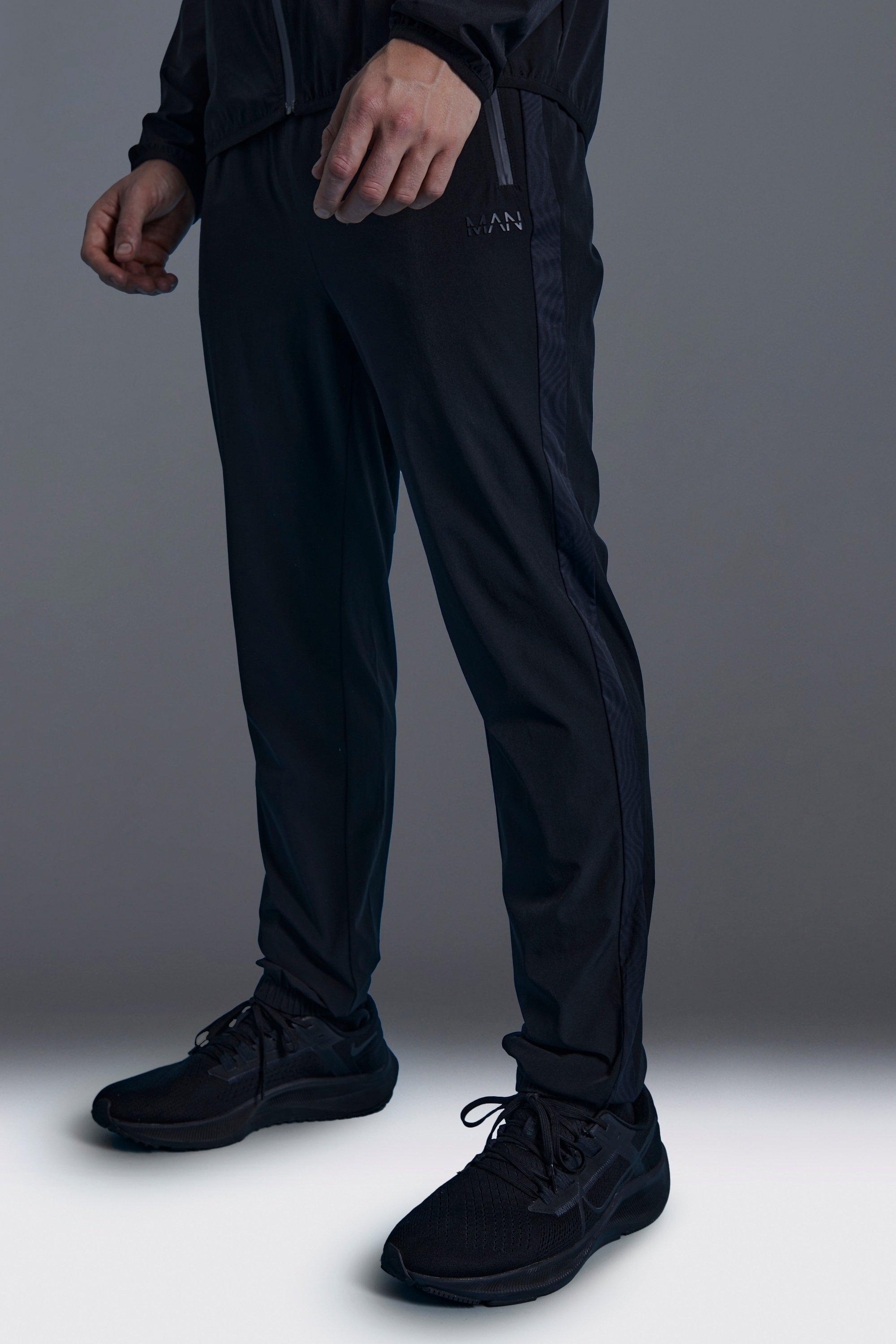 Image of Pantaloni tuta Man Active Skinny Fit con stampa di motivi geometrici, Nero