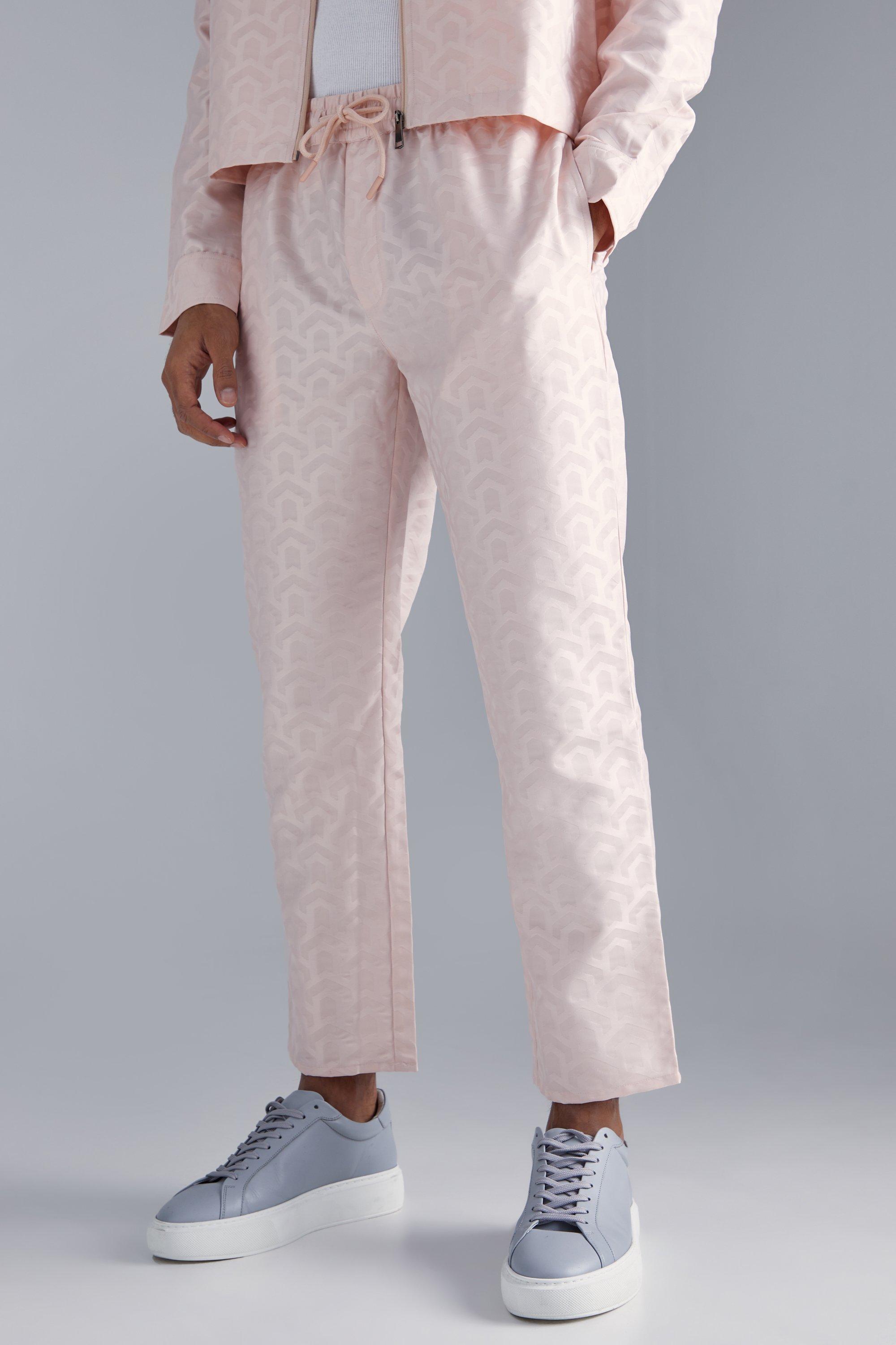 Image of Pantaloni affusolati con motivi geometrici e trama, Pink